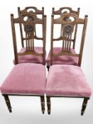 A set of four Edwardian Art Nouveau walnut dining chairs