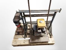 A Robin petrol plate compactor,