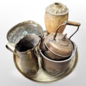 An Indian engraved brass charger, diameter 55cm,