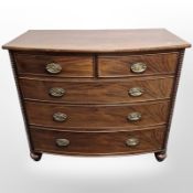 A Victorian mahogany bow-front five drawer chest,