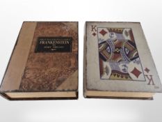 A table box in the form of a deck of cards, and another in the form of Frankenstein by Mary Shelley,