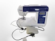 A Necchi electric sewing machine with lead and pedal.