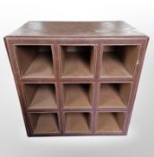A leather cube shelf, height 40cm.