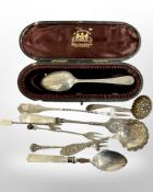 A collection of silver cutlery, pickle forks, cased spoon etc.