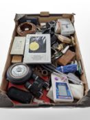 A quantity of wristwatches, trinkets, binoculars, calculators, vintage mobile phones, lighters, etc.