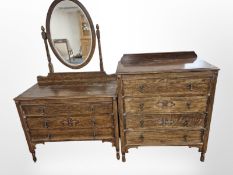 A 1920's oak chest of four drawers and matching mirror back dressing chest