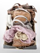 A group of lady's leather handbags.