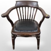 A stained beech elbow chair