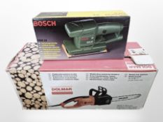 A boxed Bosch Orbital sander and a Dolmar electric chain saw (continental wiring)