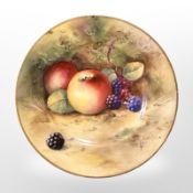 A Royal Worcester porcelain saucer hand-painted with fruit, by A G Moseley, diameter 12cm.