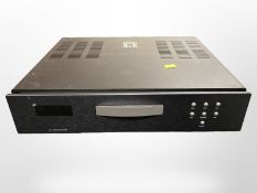 A Primare 30.2 compact disk player, with power lead, together with a Primare C20 remote control.