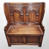 A Chapmans Siesta oak storage settle,
