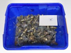 A quantity of brass door handle collars.