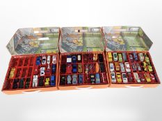 Three cases of Matchbox die-cast vehicles.