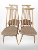 A set of four Ercol elm and beech spindle back dining chairs