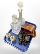 A small pair of Japanese porcelain vases, a pair of French binoculars and two crystal decanters.