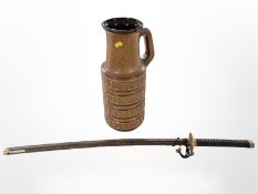 A reproduction Japanese katana and a West German pottery jug.