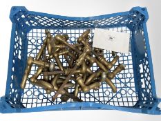 A crate of vintage brass door handles.