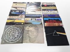 A collection of vinyl LP records including John Lennon, The Beatles, Pink Floyd, Bad Company,