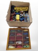 A display case and a large quantity of assorted die-cast vehicles including Corgi.