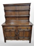 An Ercol stained elm dresser,