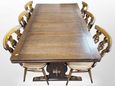 An Ercol stained elm extending refectory dining table,