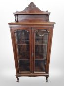 A glazed mahogany double door display cabinet,