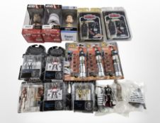 A group of Disney Star Wars bobble head figurines, lightsaber toys, The Black Series figurines, etc.