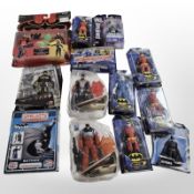 13 Bandai, Spin Master, and other figurines including Batman, Justice League, etc., boxed.