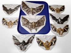 A group of taxidermy bat specimens laid to card.