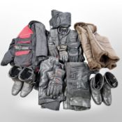A group of motorbike leathers, boots, riding gloves, two helmets etc.