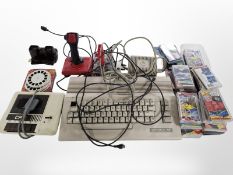 A Commodore 64 personal computer, together with two joysticks, a quantity of game cassettes,