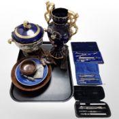 A group of precision drawing instruments, business card case, whistle,