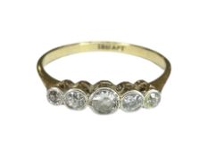 An 18ct gold and platinum five-stone diamond ring, size P CONDITION REPORT: 2.