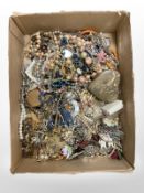 An interesting collection of costume jewellery, trinkets, compact, etc.