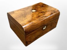 A Victorian mother of pearl inlaid sewing box.