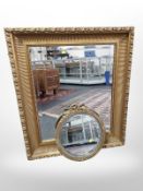 An ornate reproduction gilt framed over mantel mirror, 98 cm x 82 cm,