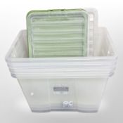 Four 80 litre plastic storage boxes with lids