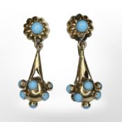 A pair of gold and turquoise cabochon drop earrings with screw fittings, length 3.5cm.