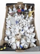 A large quantity of porcelain and crystal hand bells.