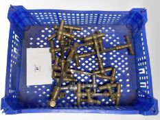A crate of vintage brass door handles.