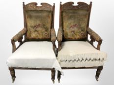 A pair of late Victorian carved walnut library armchairs (for re-upholstery)