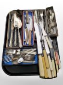 A group of stainless steel and silver-plated flat wares, and a silver napkin ring.