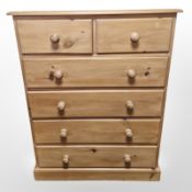 A contemporary pine six drawer chest,