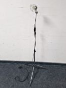 A contemporary chrome standard lamp