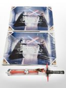 Two Star Wars glass posters, width 90cm, and a Disney Star Wars lightsaber toy.
