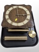 A Junghans wall clock with brass weights and pendulum.