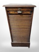 An early 20th century oak tambour office cabinet,