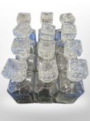 A set of 12 crystal decanters.