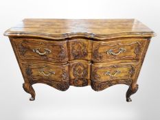 A stained pine serpentine front chest drawers on cabriole legs,